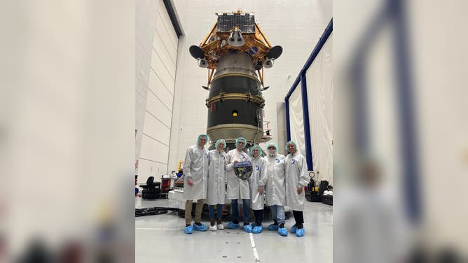 The Firefly Aerospace Blue Ghost team prepares to integrate the lander into the SpaceX Falcon 9 rocket.