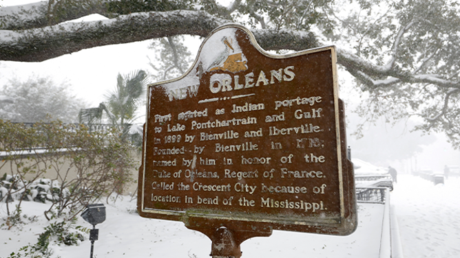 NEW ORLEANS, LOUISIANA - JANUARY 21: Snow falls on a historical information sign about New Orleans across the street from St. Louis Cathedral on January 21, 2025 in New Orleans, Louisiana. A winter storm brought rare snowfall to the Southern states including Florida, Texas and New Orleans, shutting down schools and businesses and drawing out locals, many of whom had never seen snow before. (Photo by Tyler Kaufman/Getty Images)