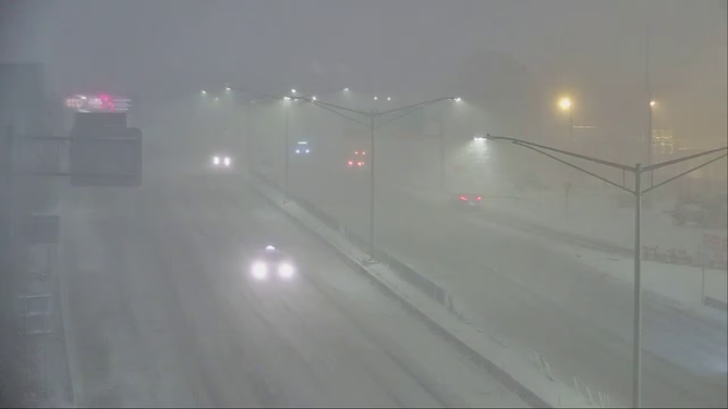 Near-whiteout conditions on Interstate 690 in Syracuse, New York, as a clipper system prompts Snow Squall Warnings.