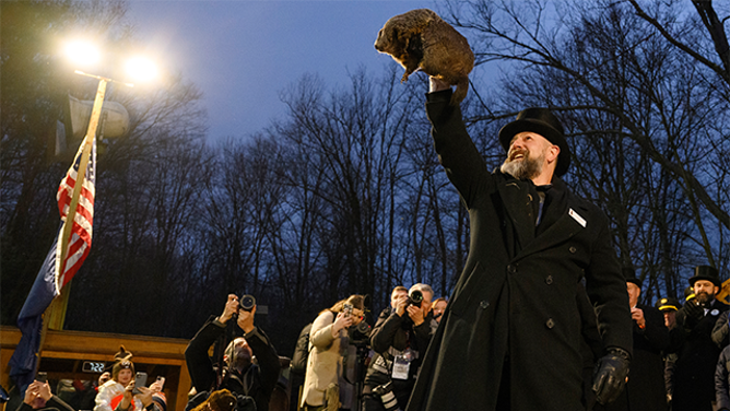 FILE - Groundhog handler AJ Dereume holds Punxsutawney Phil after he did not see his shadow predicting an early Spring during the 138th annual Groundhog Day festivities on Friday February 2, 2024 in Punxsutawney, Pennsylvania. Groundhog Day is a popular tradition in the United States and Canada. Over 40,000 people spent a night of revelry awaiting the sunrise and the groundhog's exit from his winter den. If Punxsutawney Phil sees his shadow he regards it as an omen of six more weeks of bad weather and returns to his den. Early spring arrives if he does not see his shadow, causing Phil to remain above ground. (Photo by Jeff Swensen/Getty Images)