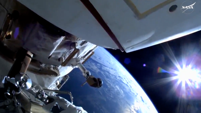 A view from Astronaut Suni William's helmet camera during a spacewalk as the ISS orbits over 260 miles above the South Pacific Ocean.