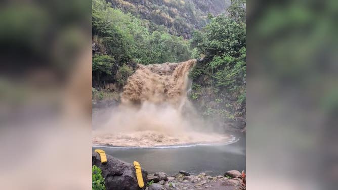 Water blasts down Waimea Falls on Oahu.