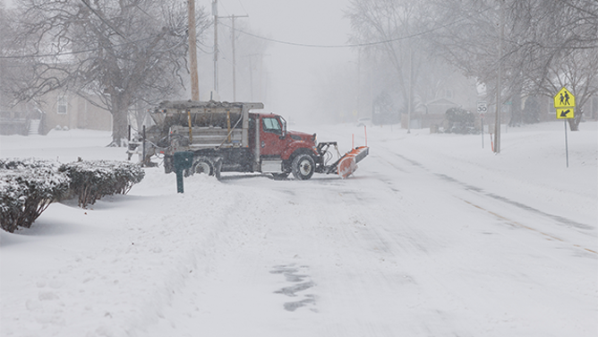 SHAWNEE, KANSAS - JANUARY 5: A salt and plow truck pulls onto a road on January 5, 2025 in Shawnee, Kansas. A large swath of the U.S., across the Midwest to the East Coast is experiencing a major Winter storm, with more than two feet of snow in some areas. A state of emergency has been declared in Kentucky and Virginia. (Photo by Chase Castor/Getty Images)