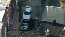 See it: Sinkhole swallows car on Philadelphia street