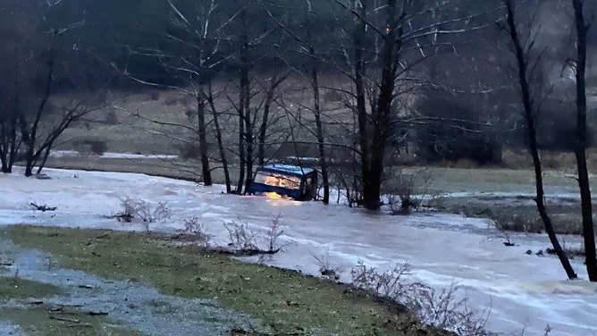 Three Appalachian Power linemen are being hailed as heroes for rescuing a driver swept away by floodwaters in Thaxton, Virginia. The crew, working to restore power after last week's ice storm, witnessed the motorist's vehicle being swept away. One lineman waded through neck-deep, frigid water to reach the man. All four were treated for hypothermia and released from a local hospital. Remarkably, the three linemen returned to work the next day to continue power restoration efforts.
