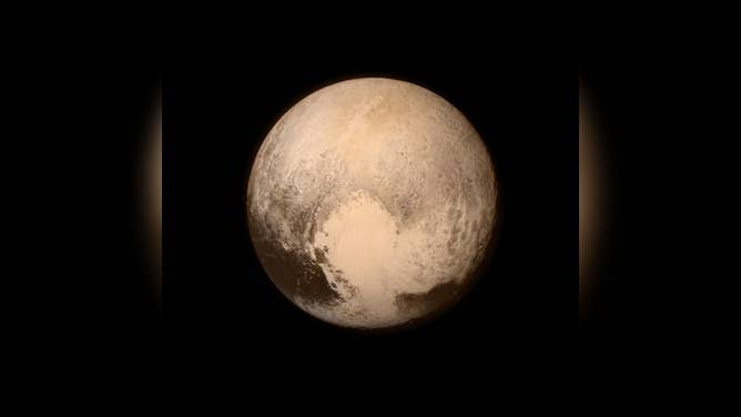 Pluto nearly fills the frame in this image from NASA's New Horizons spacecraft. The image was taken on July 13, 2015, when the spacecraft was 476,000 miles (768,000 kilometers) from the surface. This is the last and most detailed image sent to Earth before the spacecraft's closest approach to Pluto on July 14.
