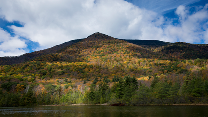 FILE - The Fall colours at picturesque and spectacular The Equinox Mountain and Pond in Manchester, Vermont, USA. (Photo by Tim Graham/Getty Images)