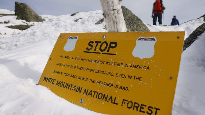 Mount Washington, NH - February 27: A sign that has blown down tells hikers that Mount Washington is home to "the worst weather in America" advising them to turn back if the weather is bad.