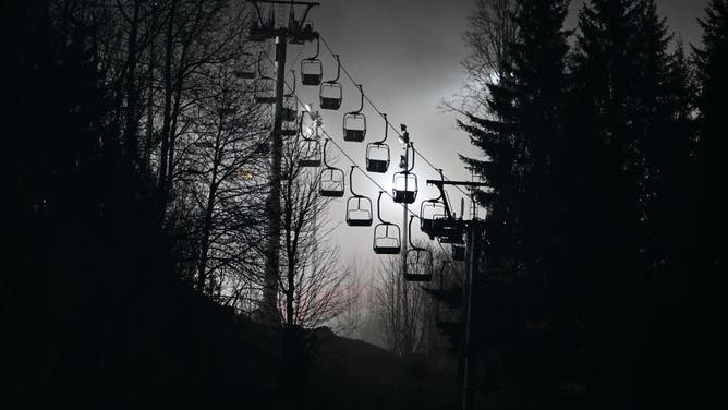 Chairlift over trees.