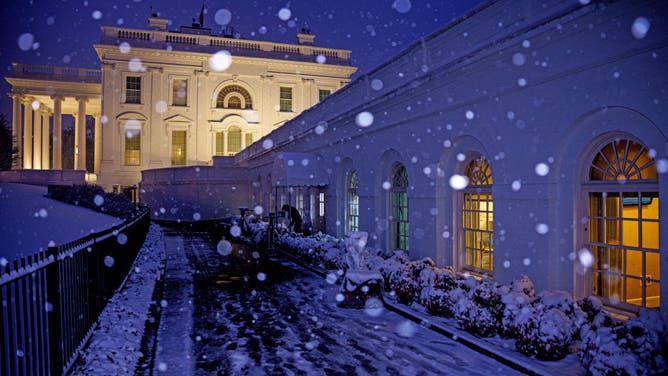 WASHINGTON, DC - FEBRUARY 11: Snow falls on the North Lawn of the White House on February 11, 2025 in Washington, DC. A winter storm is expected to drop 3-6 inches of snow on the Washington metropolitan area.