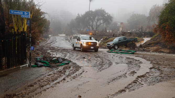 Crews monitor the rain in the Eaton fire burn zone where a potentially dangerous storm is bearing down on the Southland, prompting evacuation warnings in multiple areas today amid fears that steady downpours could spark flooding, mudslides and debris flows