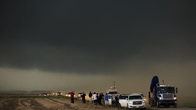 A caravan of storm chasers arrive