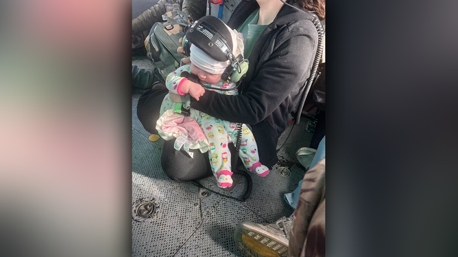 Troopers shared a heartwarming photo of one of the youngest survivors of the devastating weekend flooding.