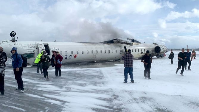 Delta flight from Minnesota crash lands upside down in Toronto, photos