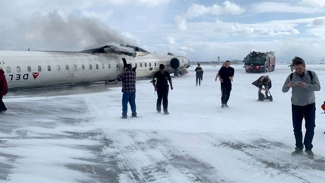 Delta flight from Minnesota crash lands upside down in Toronto, photos