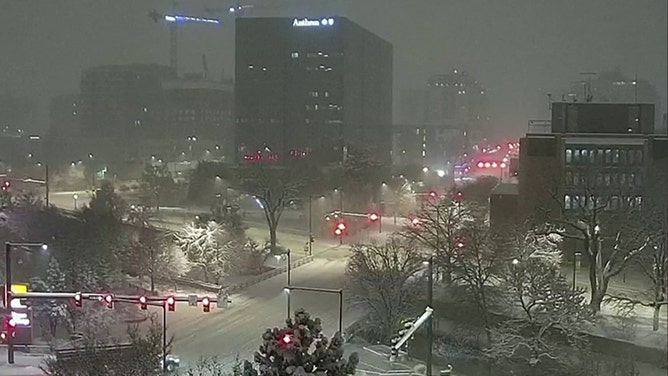 A snowy Denver skyline could be seen Friday morning.