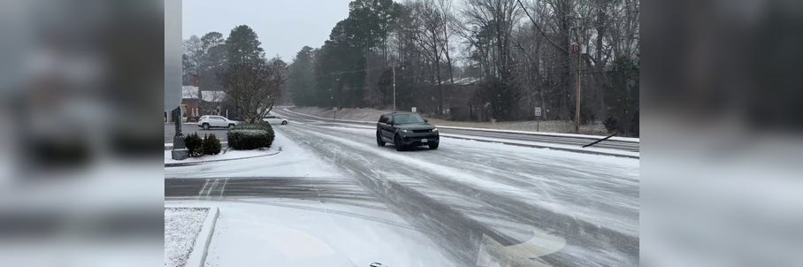 Snow-covered roads lead to treacherous travel as winter storm barrels across US toward East Coast