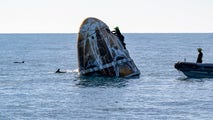 Dolphins welcome astronauts back to Earth after 9 months, swimming around SpaceX Dragon capsule