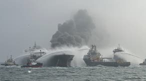 US tanker carrying 220,000 barrels of jet fuel catches fire after being hit by container ship off coast of UK