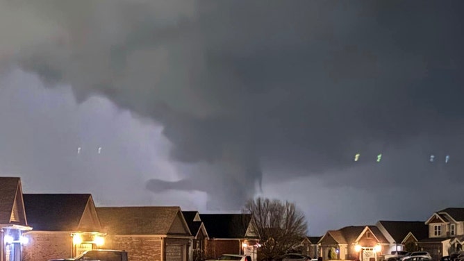 A photo from Jay Burden in Evansville shows a tornado's path towards Oakland City, Indiana. The storm left a trail of destruction across Gibson County, with widespread reports of downed trees, power lines and utility poles, according to authorities.