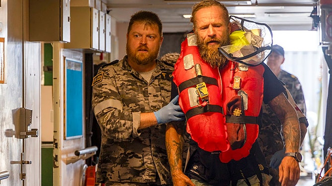 A Lithuanian solo rower has been rescued from the treacherous waters of the Coral Sea after being caught in the path of Tropical Cyclone Alfred.