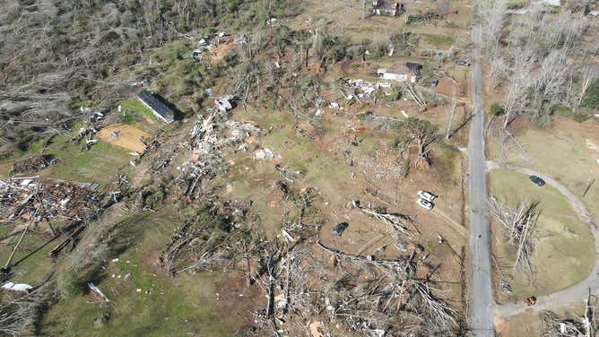 Trees lay toppled and building are destroyed after severe weather in Dallas County, Alabama.