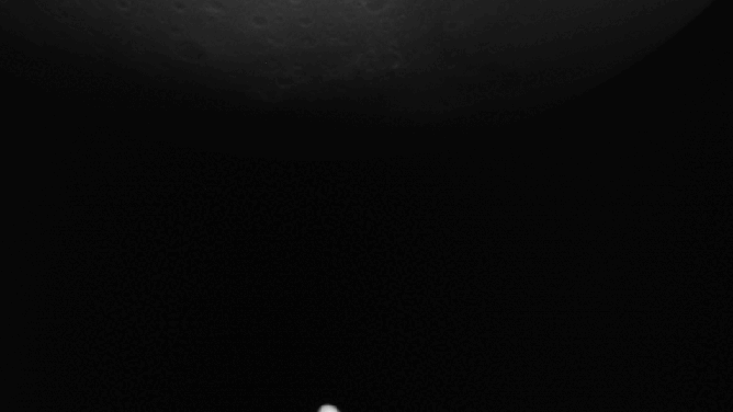 Mars moon Deimos crossing the red planet as seen by Hera's camera.