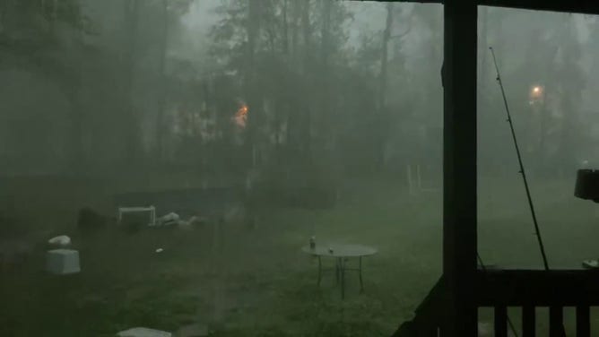 This image shows a dark sky above Livingston, Louisiana, as heavy rain and strong winds slam the town during severe weather on March 24, 2025.