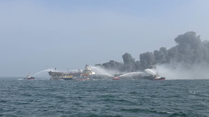 AT SEA, UNSPECIFIED - MARCH 10: Fire and rescue services attend after a collision between oil tanker MV Stena Immaculate and the cargo vessel MV Solong off the coast of the Humber Estuary on March 10, 2025 in At Sea, Unspecified.