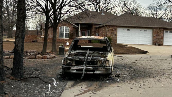 A car in the Mckinleys' neighborhood that was burned in wildfire.