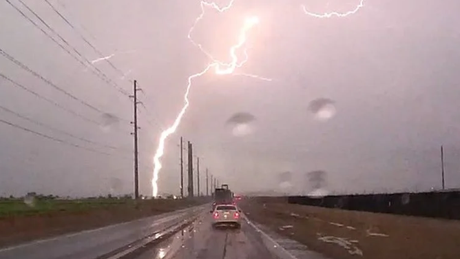 FILE - A lightning strike was photographed by Terry Simpson in Glendale, Pennsylvania.