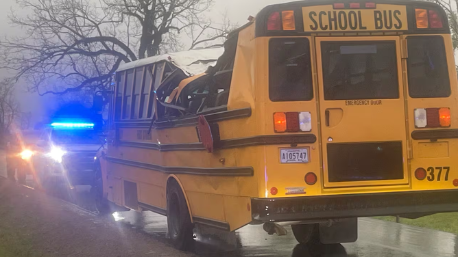 A damaged school bus in Zachary, Louisiana on Monday, March 25, 2025 after a tree fell on it during a storm.