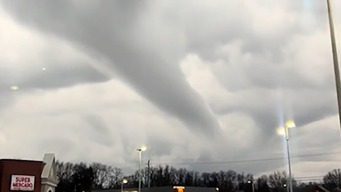 A funnel cloud was spotted looming over downtown Indianapolis, Indiana, on Sunday, as captured in a video by DJ GNO on TikTok.