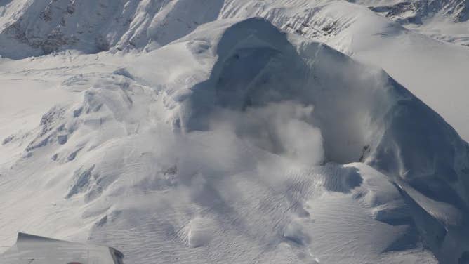 Gas vents and steaming cracks around the flanks of Mount Spurr's summit are visible to the lower left of the summit crater