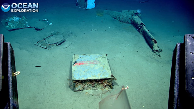 Unknown debris covered with paint.