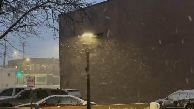 This image shows snow starting to coat roads and sidewalks in Sioux City, Iowa, as a powerful winter storm beginning to impact the region on Wednesday, March 19, 2025.