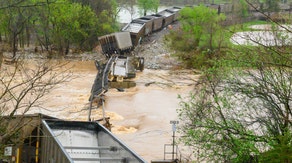 Train derails in Arkansas as swollen river floods bridge in state park
