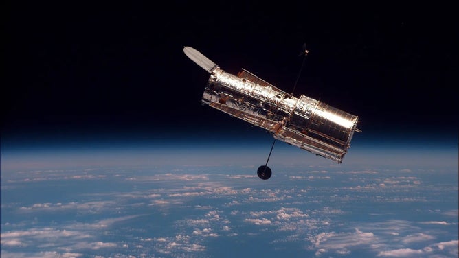 Hubble in Earth's orbit.