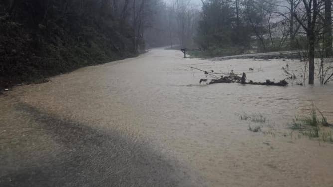 A road disappears under floodwater in Morgan County in eastern Kentucky.