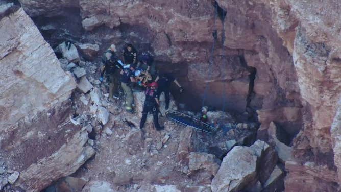 Photos show first responders preparing a basket and backboard for extraction. 