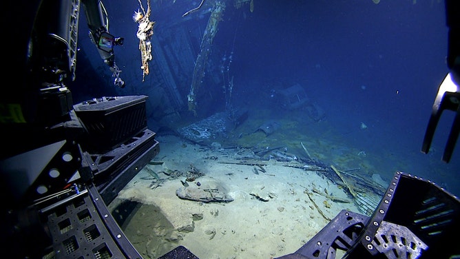 View of the Ford automobile in the hangar of USS Yorktown upon approach during Dive 07 of the Papahānaumokuākea ROV and Mapping expedition.
