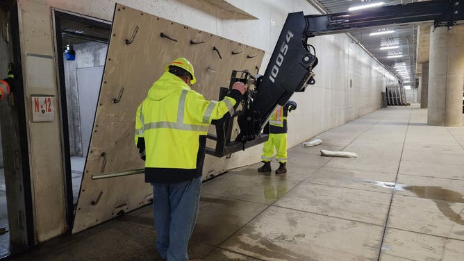 ODOT crews install flood gates in the Riverfront Transit Center in downtown Cincinnati.