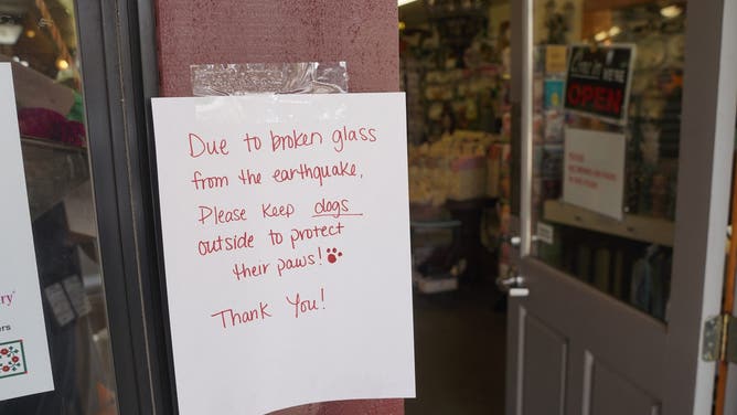 JULIAN, CALIFORNIA, UNITED STATES - 2025/04/14: A store posts a notice at the entrance and tells the consumers that there are some broken glass due to the earthquake. A 5.2 magnitude earthquake struck near Julian, east of San Diego, around 10 a.m. on April 14, shaking much of Southern California. The quake was felt across San Diego County, with reports extending to Los Angeles County and even parts of Mexico. According to the USGS, several aftershocks followed the main quake. Residents in Julian reported feeling strong shaking for a few seconds, but there were no injuries or significant damage reported in the town. (Photo by Michael Ho Wai Lee/SOPA Images/LightRocket via Getty Images)