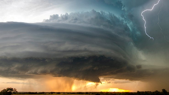 FILE A stunning "wedding cake" supercell seen near Severy, Kansas, caught with lightning to the side.