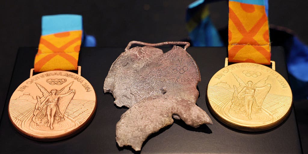 Olympic swimmer presented replacement medals following devasting loss in California wildfire