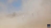 Watch: 'Mini tornado' of dust overtakes little league softball game in Illinois