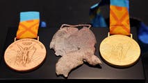 Olympic swimmer presented replacement medals following devasting loss in California wildfire