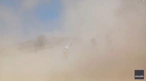 Watch: 'Mini tornado' of dust overtakes little league softball game in Illinois