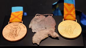 Olympic swimmer presented replacement medals following devasting loss in California wildfire