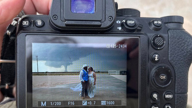 New Mexico newlyweds Daynnely and William Carrillo had an unforgettable start to their marriage when a tornado formed in the background of their wedding photos. Photographer Chesnea Clemmons seized the unique moment, capturing an epic shot.
